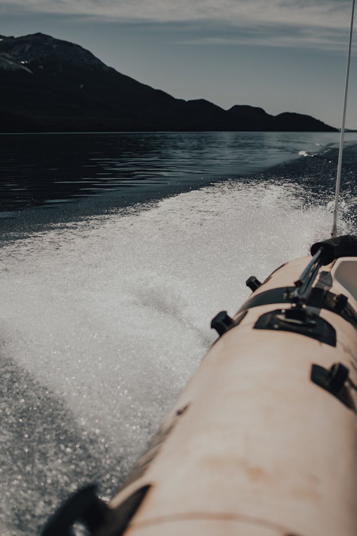 The Art of Drawing Readers In: Your attractive post title goes here View from a boat ride showcasing water trails and distant mountains on a calm day.